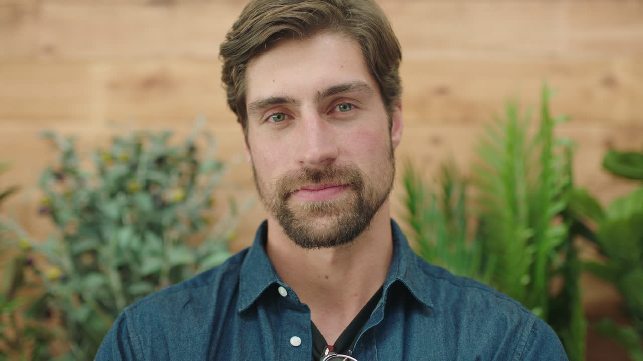 attractive young man portrait of handsome bearded caucasian guy  looking pensive serious at camera