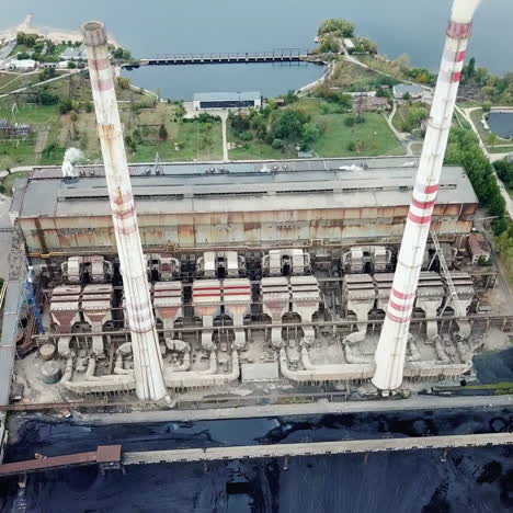 aerial view of thermal power station. combined modern power plant for urban district heating and power generation. industrial zone from above.