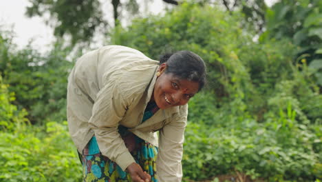 a woman working in a rural garden