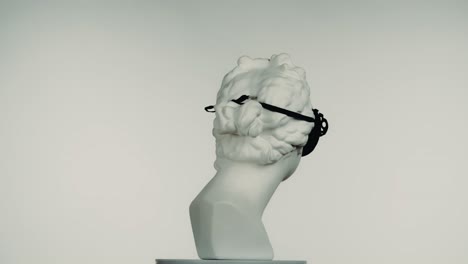 marble bust with black mask