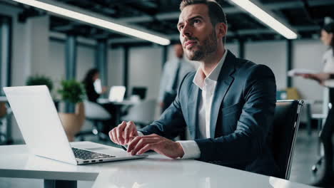 businessman working on laptop in a modern office