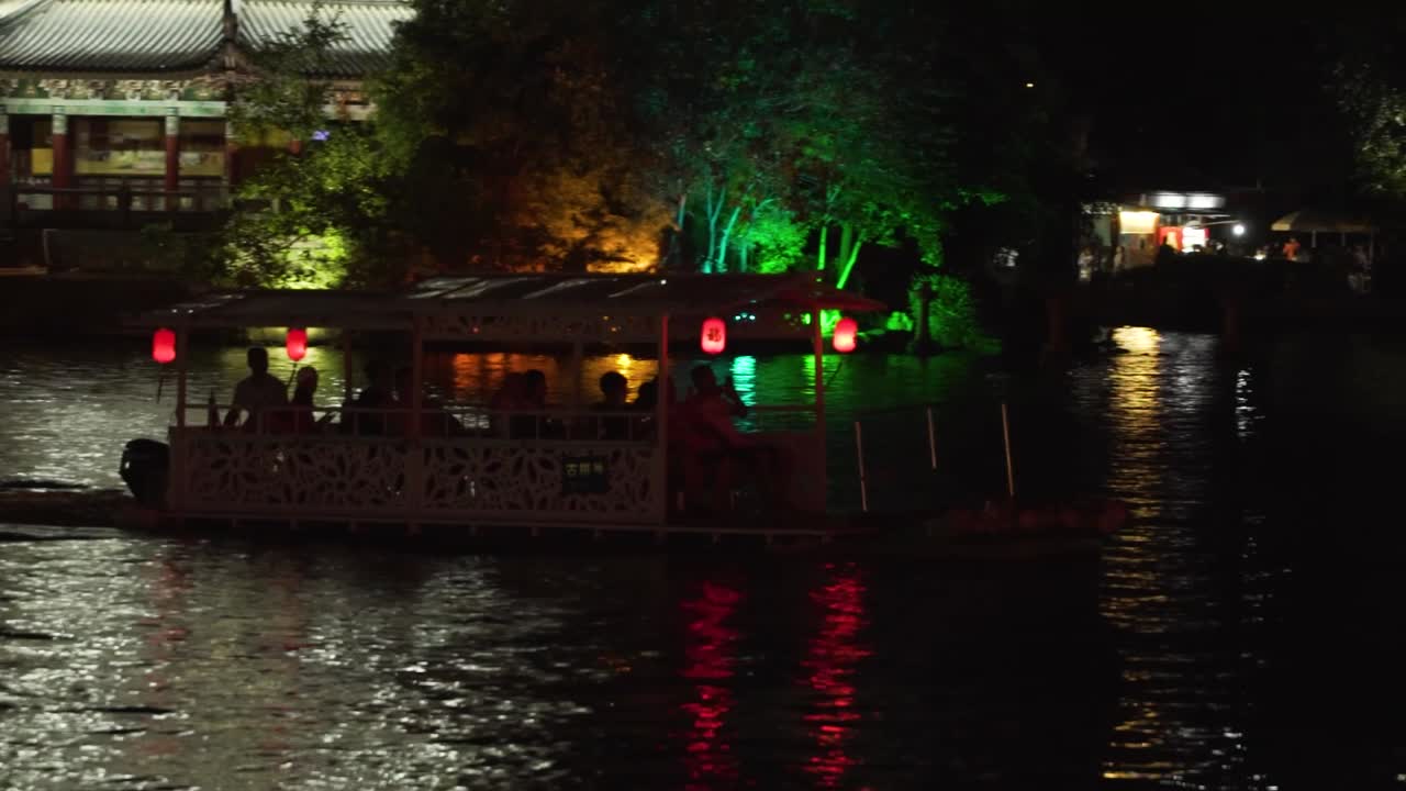 Boat in the lake at night in Guilin Sun and Moon Pagodas