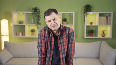 depressed man crying and wiping tears, feeling lonely and helpless in his grief.