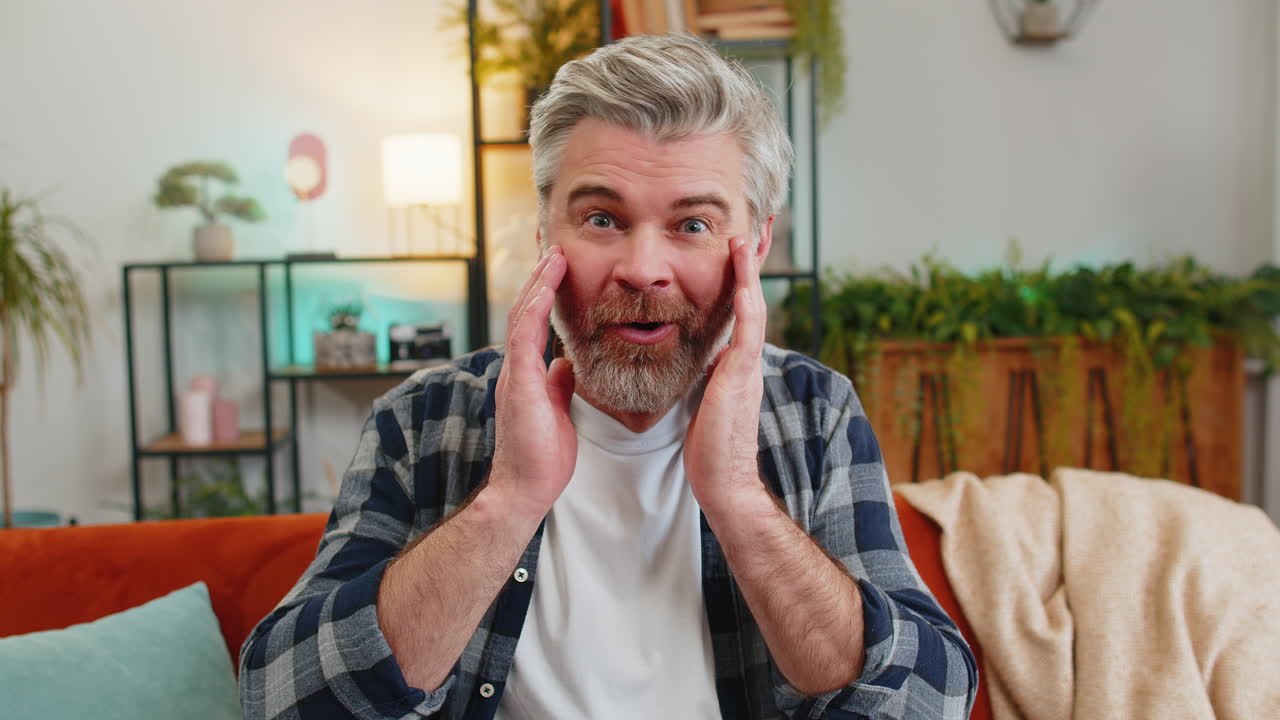 Wow emotion of senior old man surprised looking at camera with big eyes shocked victory good win