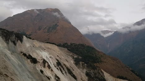 a view of a large devastating landslide in a remote region of nepal.