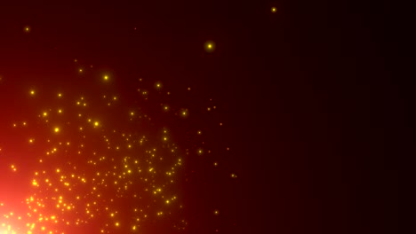 pequeñas partículas de oro y estrellas en fondo oscuro