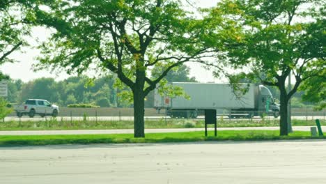 slow-motion-of-a-reefer-semi-tractor-and-trailer-driving-on-highway