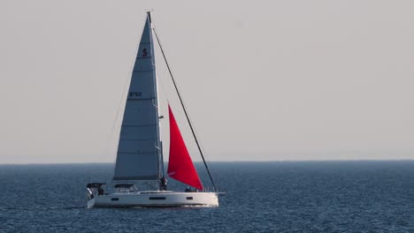 sailboat gliding across calm ocean waters