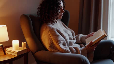 woman reading a book in a cozy home setting