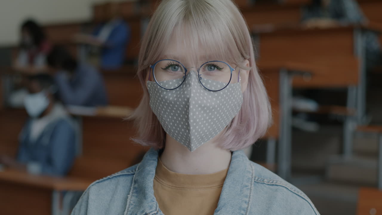 Student in a Classroom Wearing a Mask