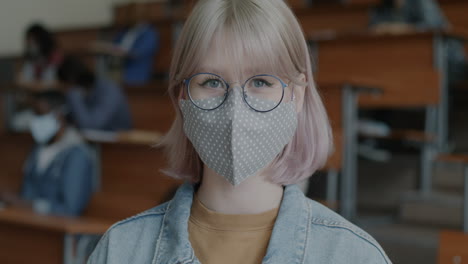 student in a classroom wearing a mask