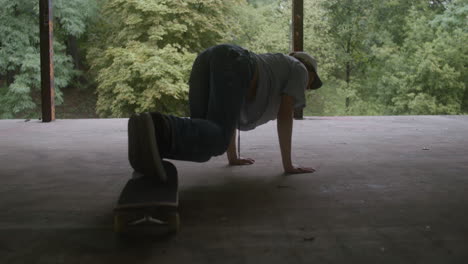 caucasian boy skateboarding in a ruined building.