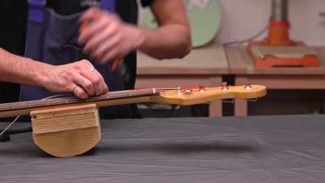 putting new string on an electric guitar