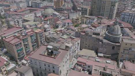 fast aerial flyover with a pan up revealing the downtown of naples, italy.