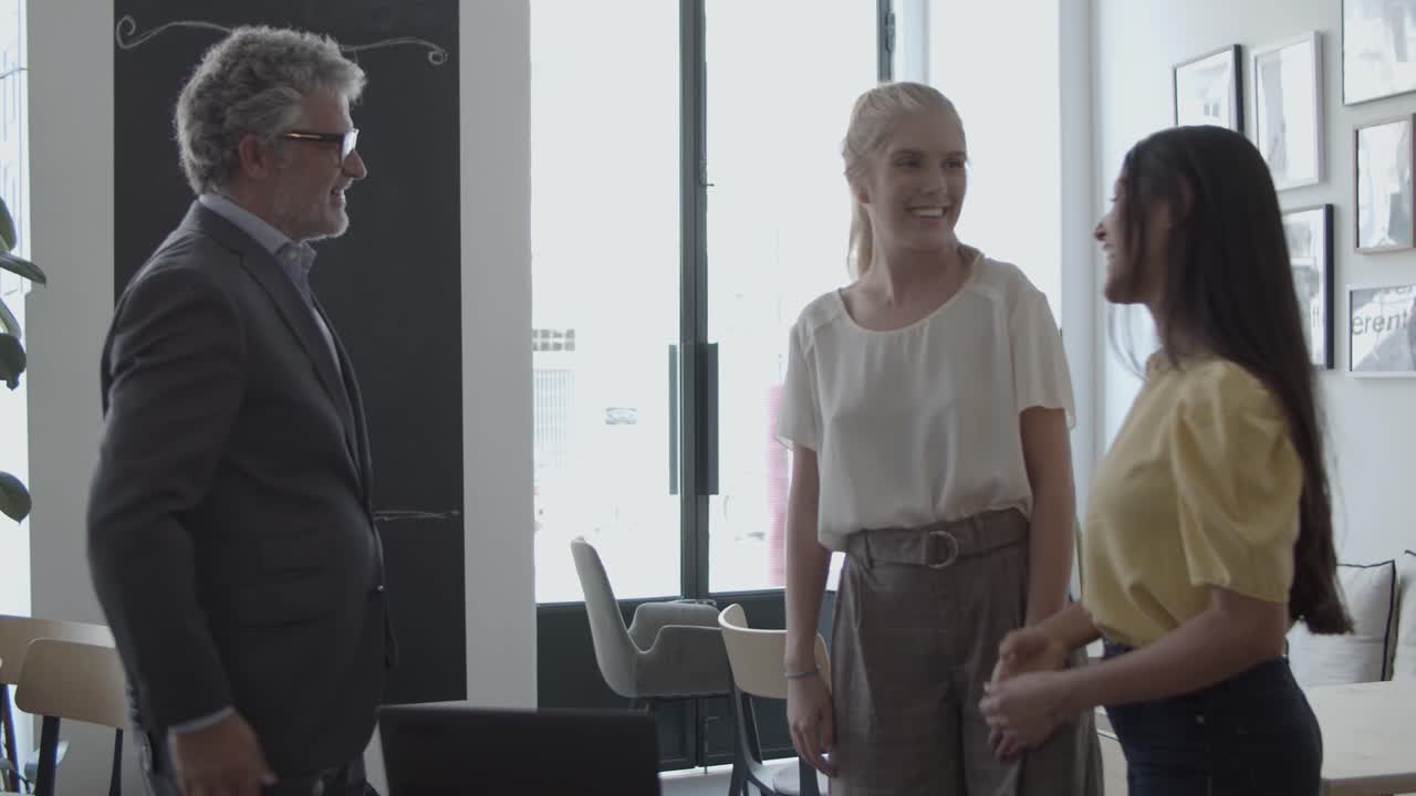 Cheerful female customers meeting with financial expert
