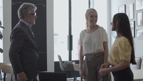 cheerful female customers meeting with financial expert