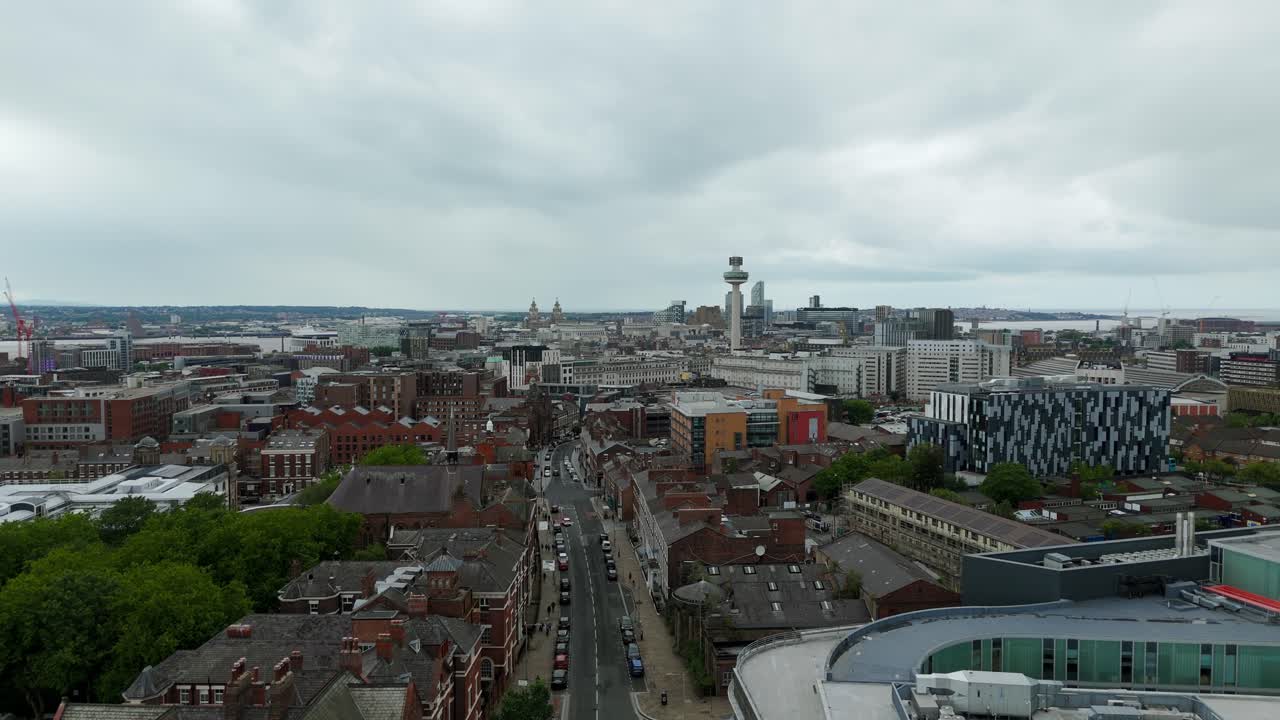Liverpool cityscape, Radio City Tower, historic and modern architecture, and River Mersey in background, England, UK. Aerial forward, copy space