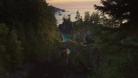 natural bridges limestone rock arch formations during sunset at oregon coast