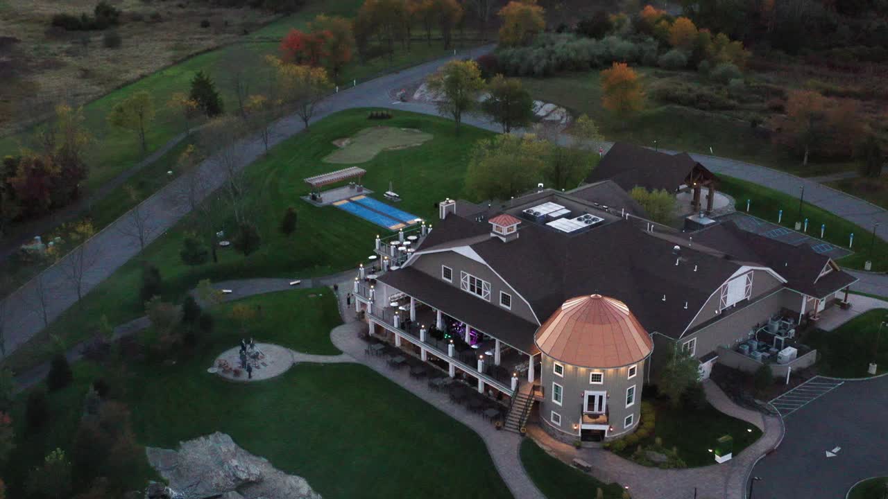 Luxury modern mansion in ascending tilt drone view