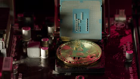 bitcoin btc and cpu central processor on digital technology pc motherboard, mining cryptocurrency