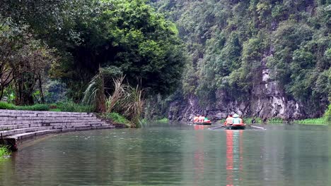 boats glide through lush, tranquil vietnamese landscape