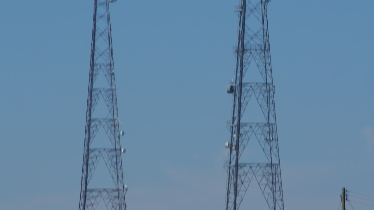 tilting down shot of a communication mast tower at Bacton
