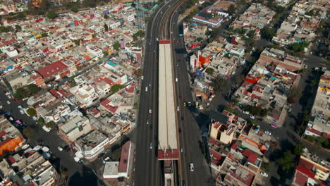 Mexico-City-traffic-highway-seen-from-an-elevated-perspective,-capturing-the-moving-cars-and-multiple-lanes