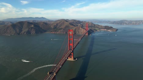 aerial view of traffic on the famous, red golden gate suspension bridge - circling, drone shot