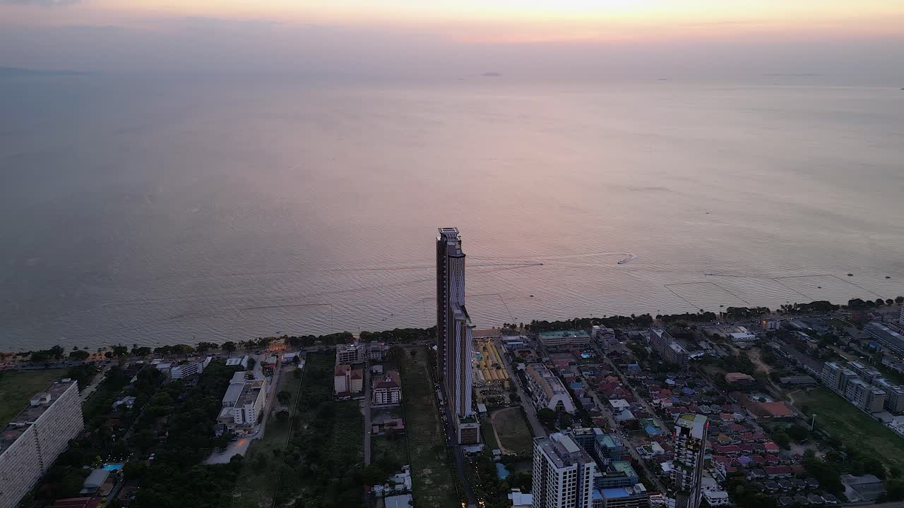 Aerial View of Highrise Building at Sunset Overlooking the Ocean