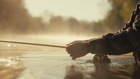 fly fishing in a misty morning