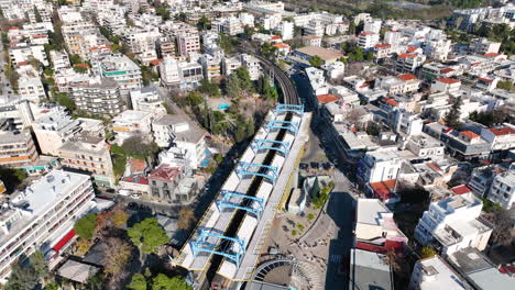 drone footage of the metro station and the railway tracks in marousi, a suburb in the north of athens, greece