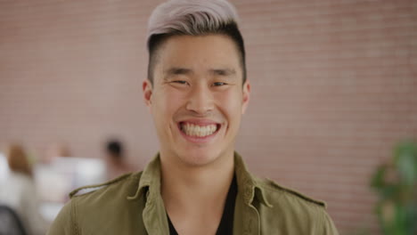 portrait happy young asian man student smiling cheerful entrepreneur enjoying successful business