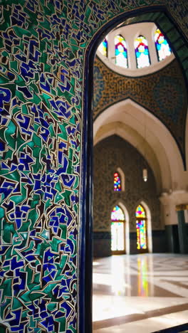 intricate tilework and stained glass in a mosque