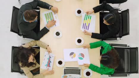 Business-people-group-meeting-shot-from-top-view