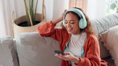 woman listening to music on couch