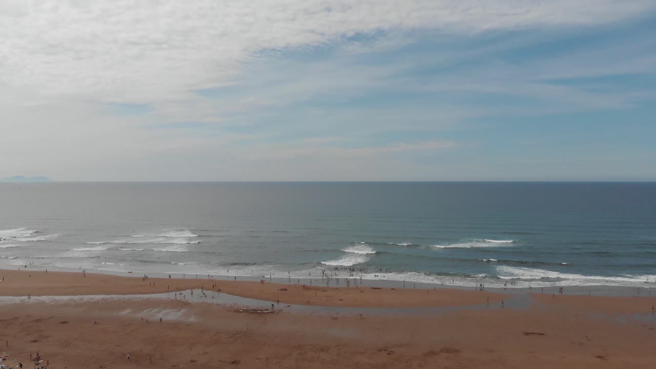 Unrecognizable people enjoying a summer day at beach, Spain