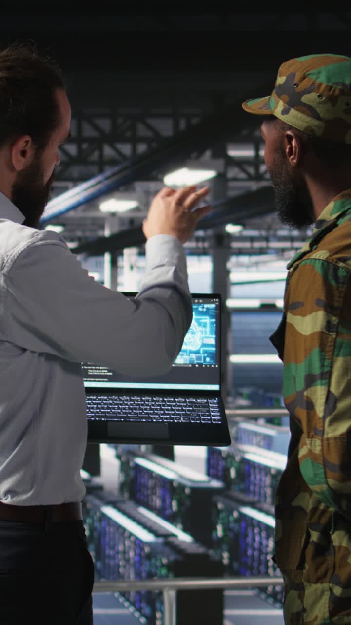 Vertical video Army technicians in command center server room using artificial intelligence
