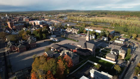 flying above residential neighborhood and church in concord, new hampshire usa