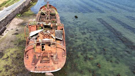 ireland epic locations drone flying over rusting ancient abandoned boat in bannow bay saltmills wexford decaying beauty on a summer day