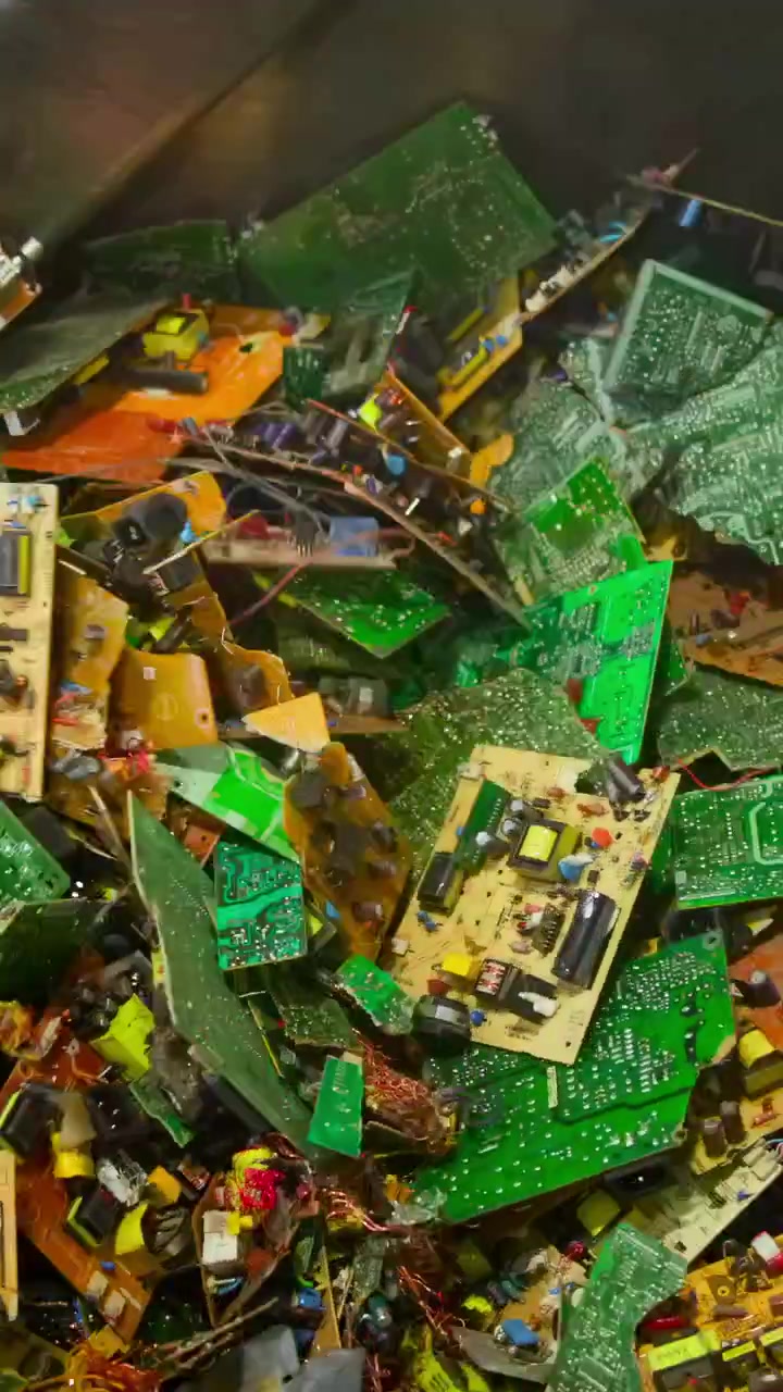 Colorful Circuit Boards In Metal Drum, Assorted Pcbs With Resistors And Capacitors Visible, Stainless Steel