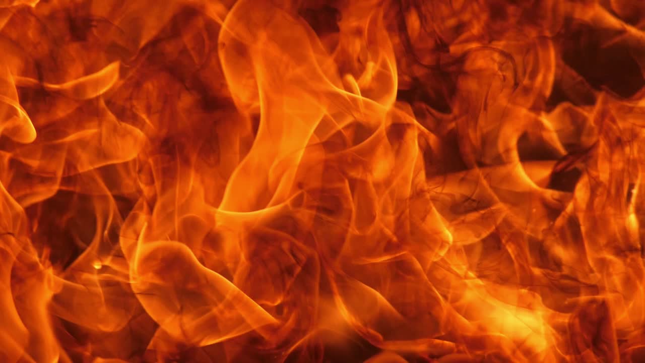 Slow motion speed close up scene of moving burning pattern as background.