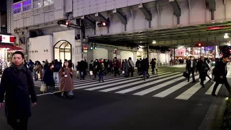 pedestrians crossing busy urban street