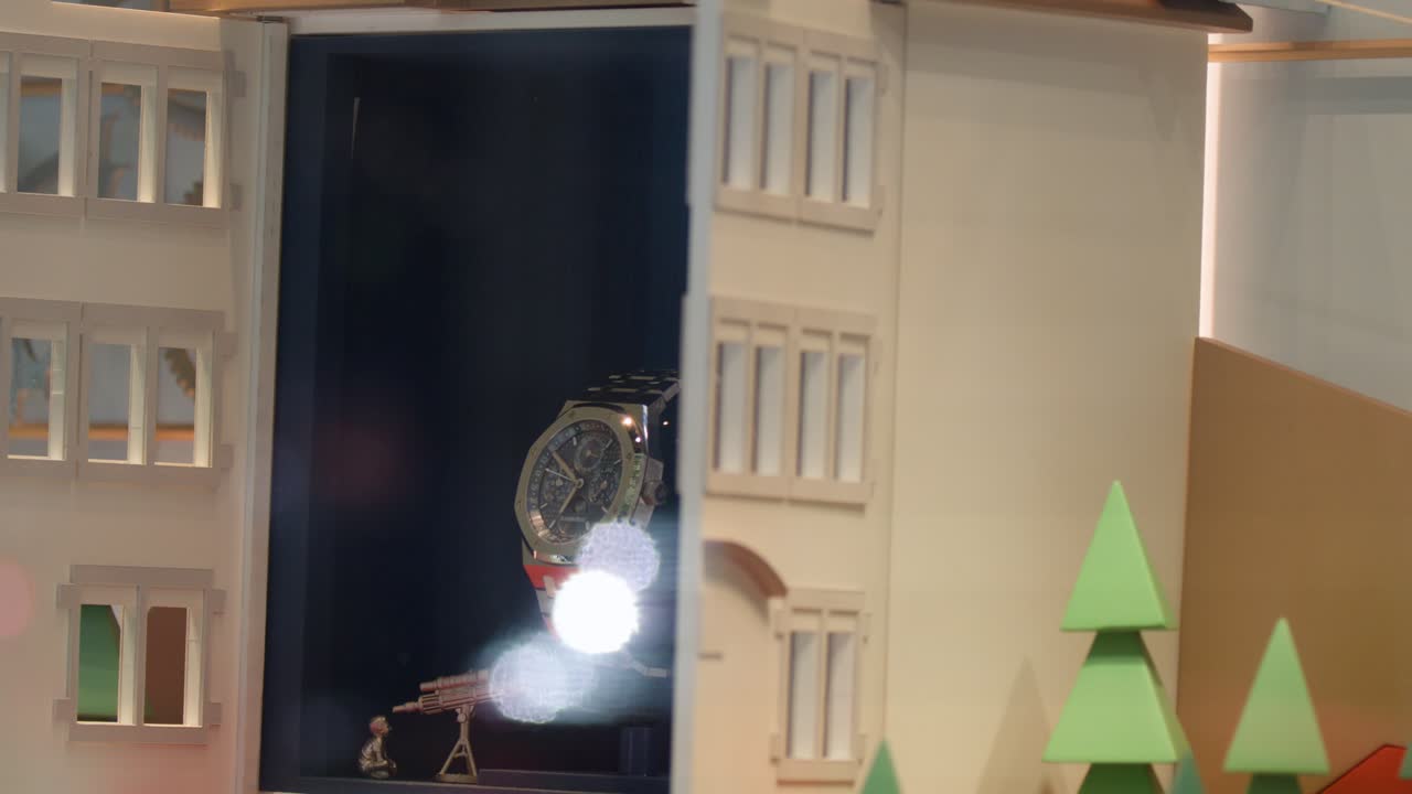 Mechanical model building facade opens to reveal luxury watch in illuminated store window display