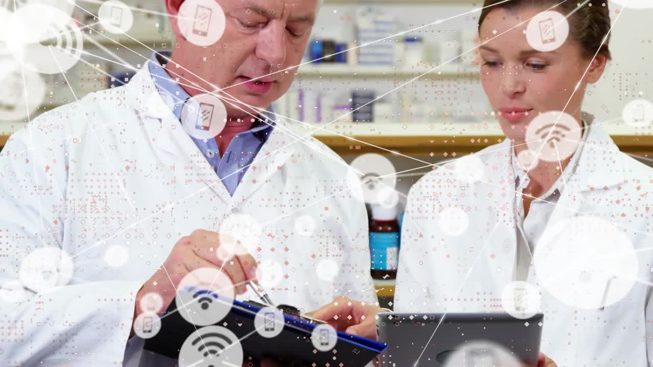 Senior tech pointing pen at tablet guiding junior verifying clipboard live overlay linking lab data