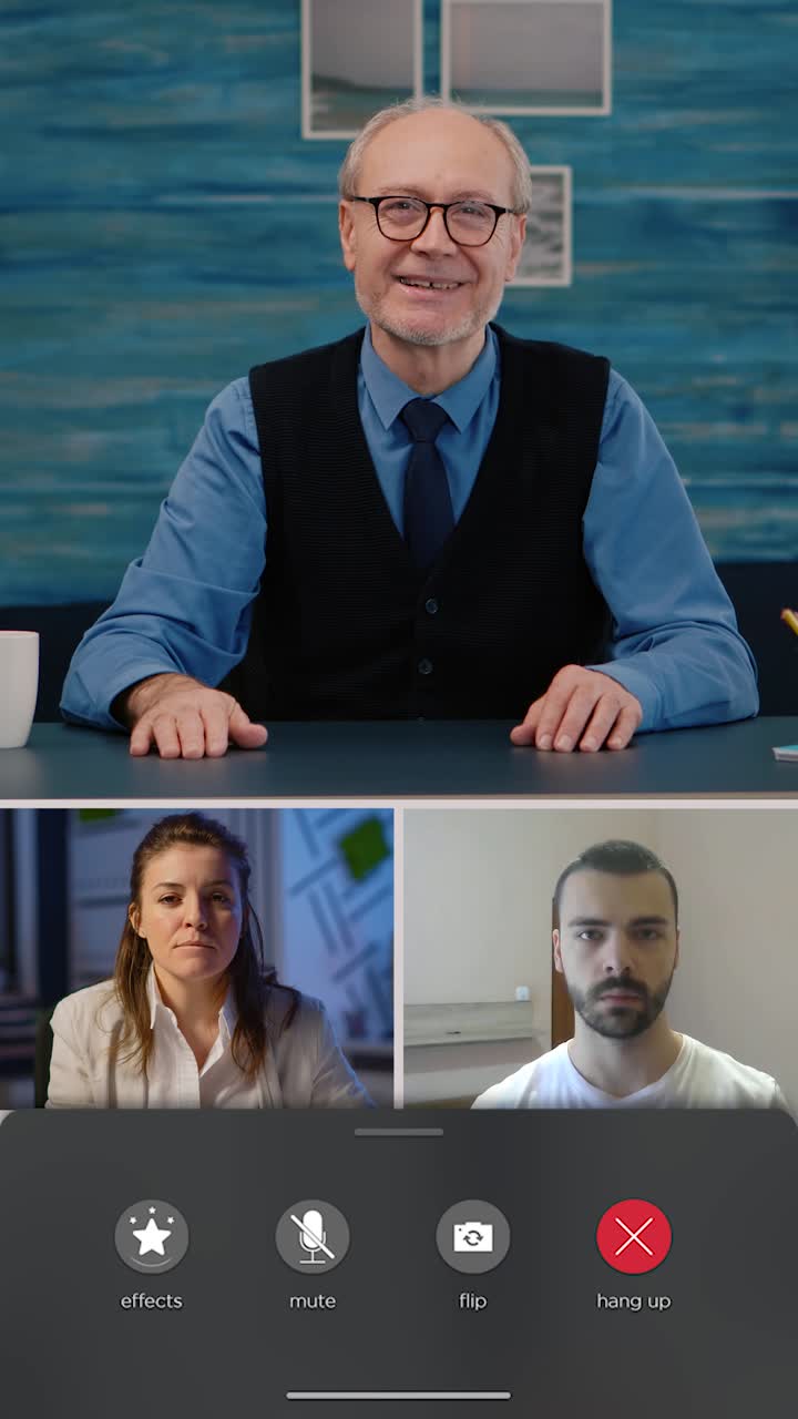 Vertical video: Team of businesspeople attending online videoconference