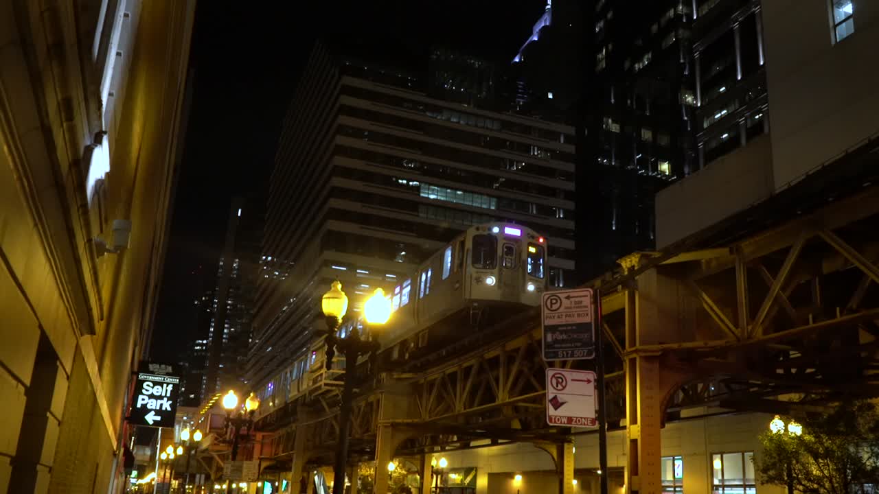 The train is driving on the railway at the night low angel