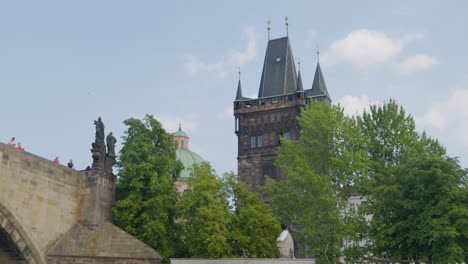 prague old town charles bridge tower, view from tourist river cruise