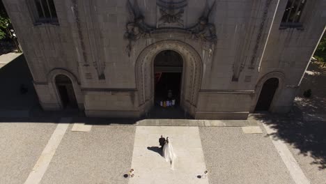 bride entering the church with the father