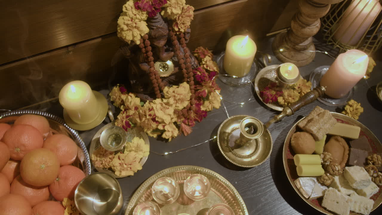 Hindu Puja with Candles and Sweets