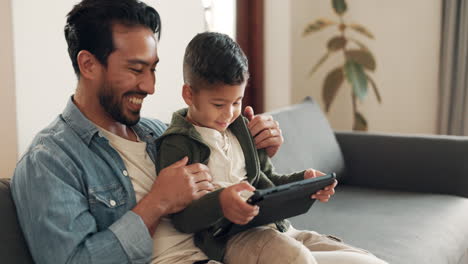 Father,-kid-or-tablet-on-sofa-in-home-for-games